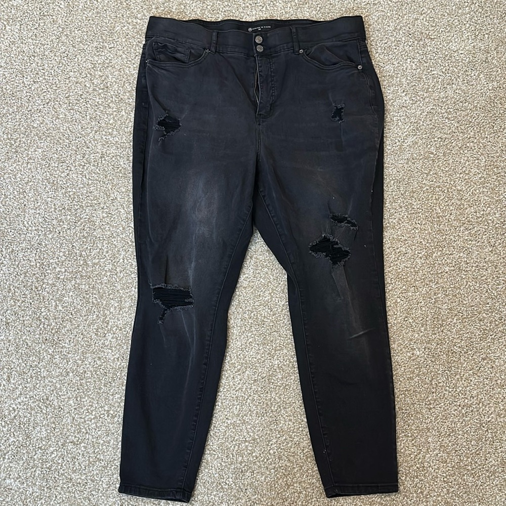 Black distressed jeans.